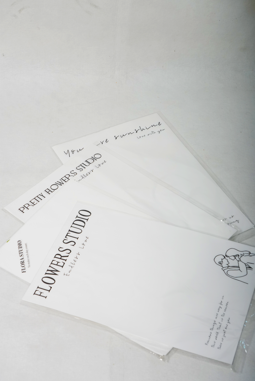 Printed White Flower Bouquet Wrapping Sheets – Minimal Text Design (Set of 10)